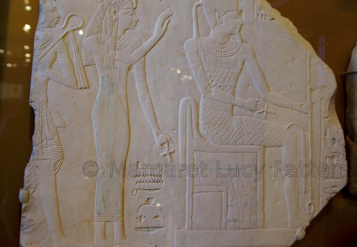 Stela Depicting Ahmose-Nefertari Behind the Seated God Amun with Her Son Amenhotep I Behind Her
