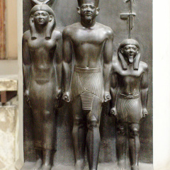 Triad Statue of Menkaure Flanked by Hathor (left) and the Nome Deity of Thebes (right)