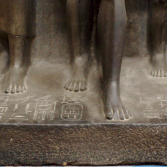 Triad Statue of Menkaure Flanked by Hathor (left) and the Nome Deity of Thebes (right)