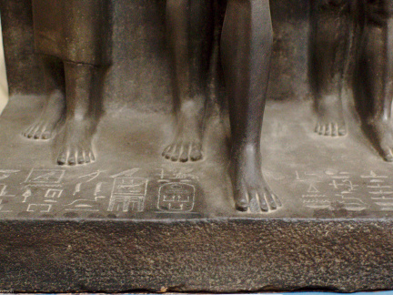 Triad Statue of Menkaure Flanked by Hathor (left) and the Nome Deity of Thebes (right)