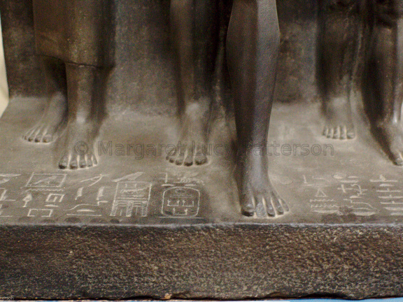 Triad Statue of Menkaure Flanked by Hathor (left) and the Nome Deity of Thebes (right)