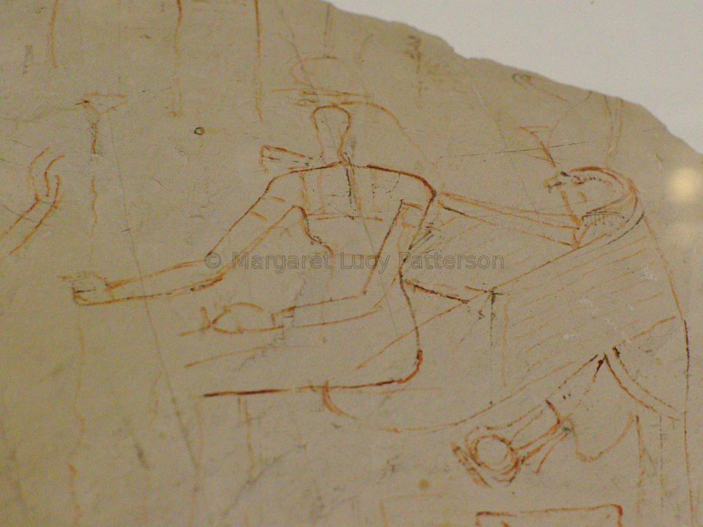 Ostracon with a Sketch of a Seated Goddess with Horus Holding a Shen Ring Behind Her