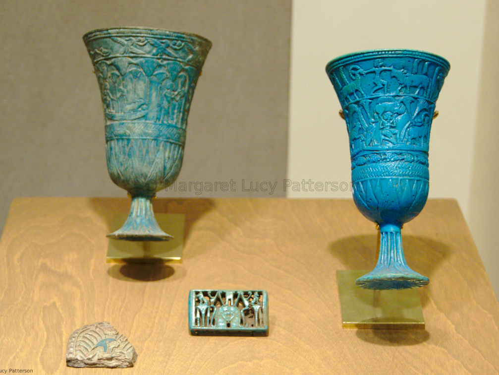 Two Relief Decorated Chalices, A Spacer and A Tile
