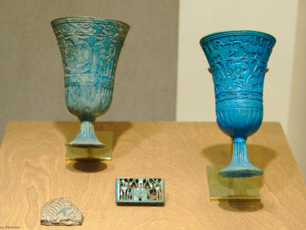 Two Relief Decorated Chalices, A Spacer and A Tile