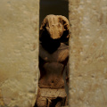 Statue of Kaemsenu Looking Through His Chapel Wall
