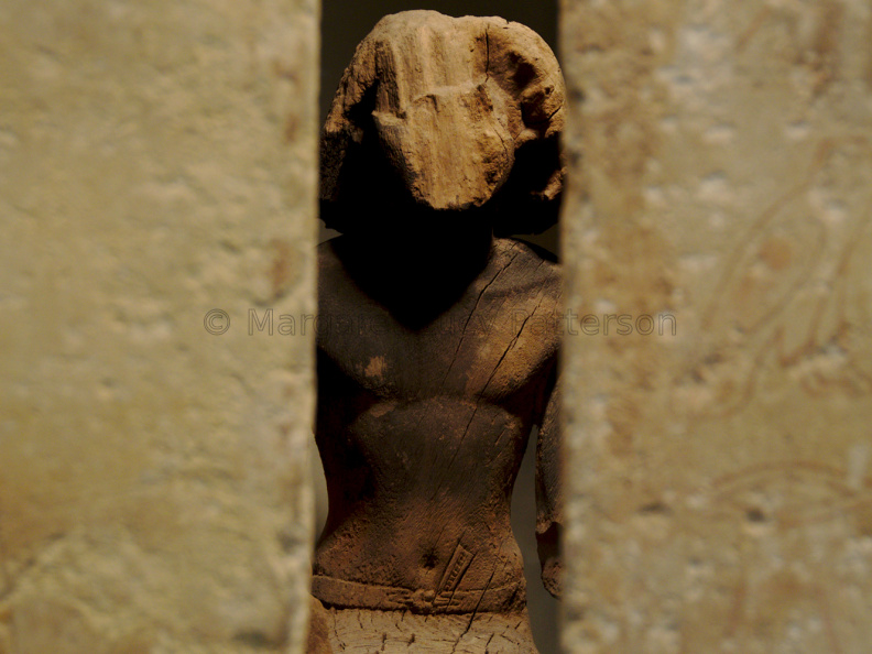 Statue of Kaemsenu Looking Through His Chapel Wall