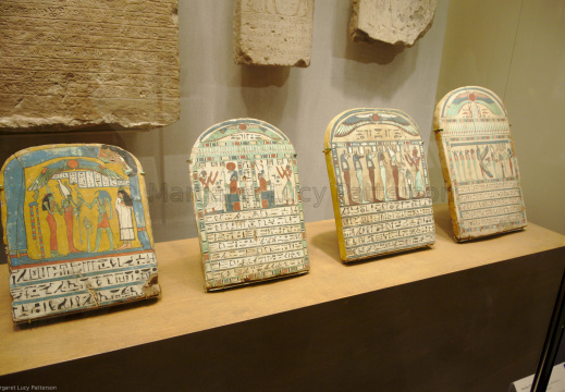Four Painted Wooden Stelae