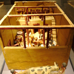 Models of a Slaughter House and a Cow Giving Birth