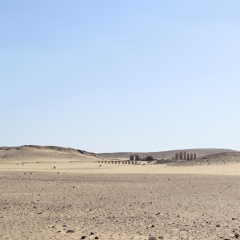 Desert Sands and Distant Ruins