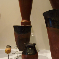 Two Black-topped Red Ware Vessels With a Model Vessel (left)