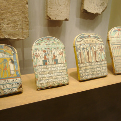 Four Painted Wooden Stelae