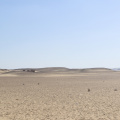 Desert Sands and Distant Structures