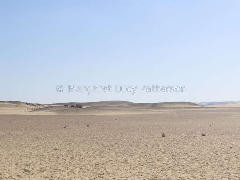 Desert Sands and Distant Structures