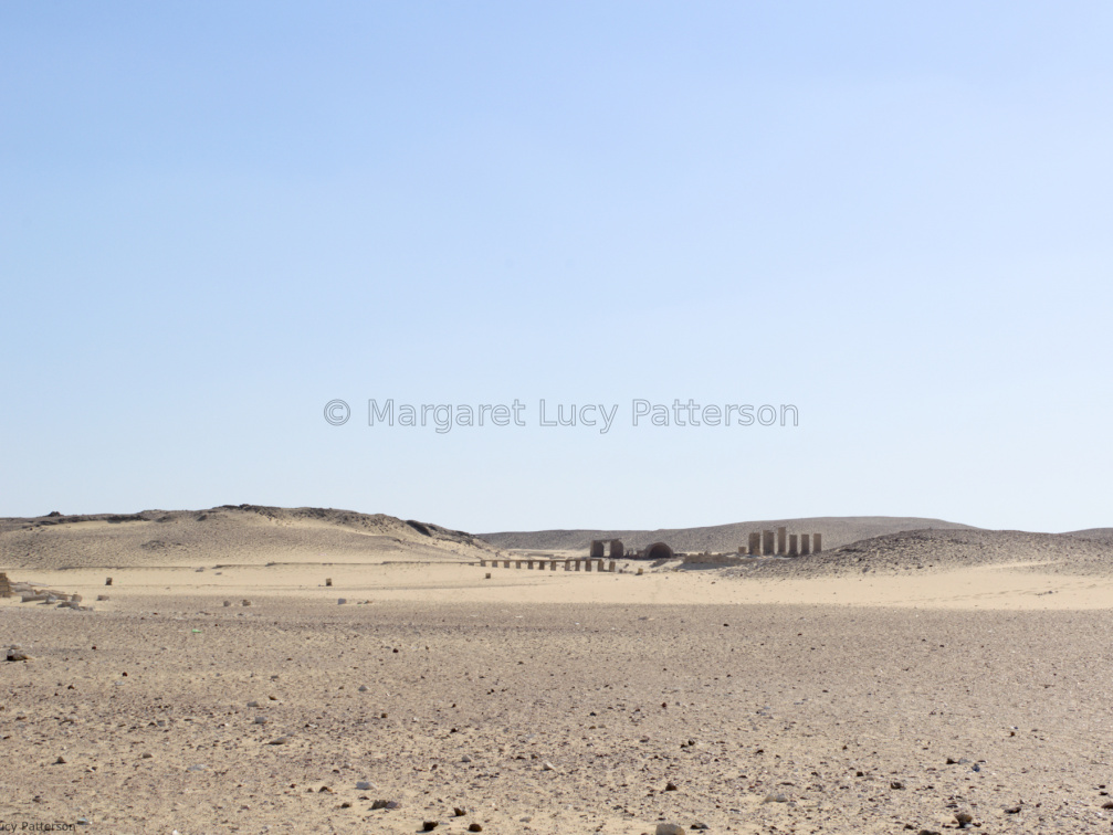 Desert Sands and Distant Ruins